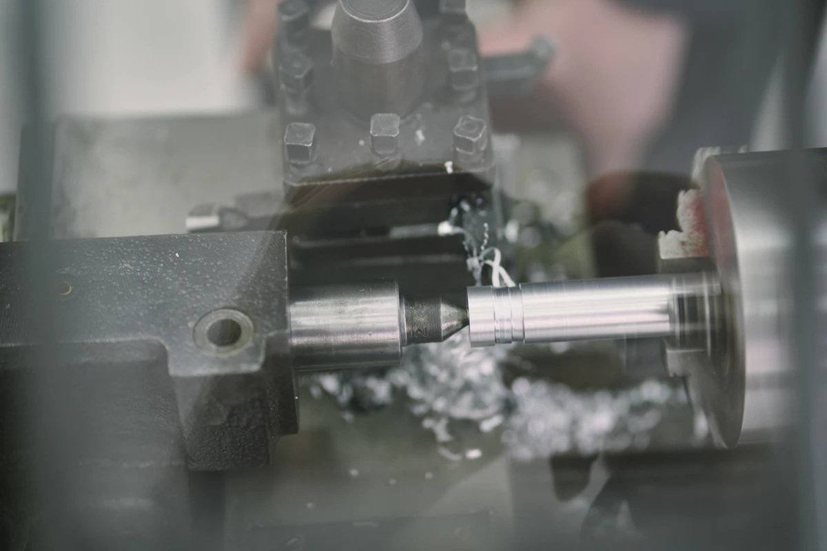 Metal lathe cutting a cylindrical component